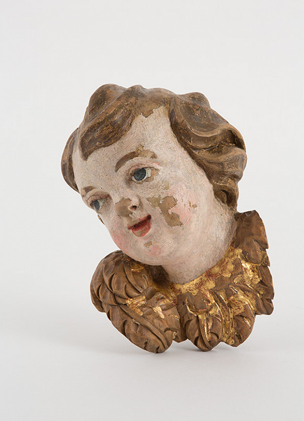 Slovenský rezbár z 2. polovice 18. storočia – Hlava anjela s krídielkami 